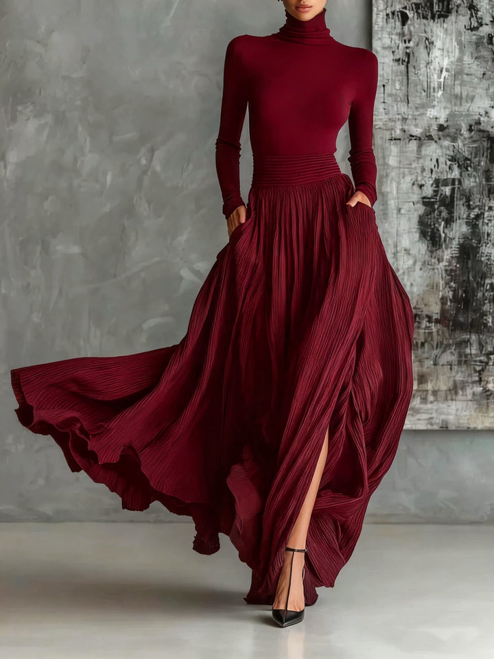 Marion | Black outfit with a turtleneck and a flowing pleated skirt