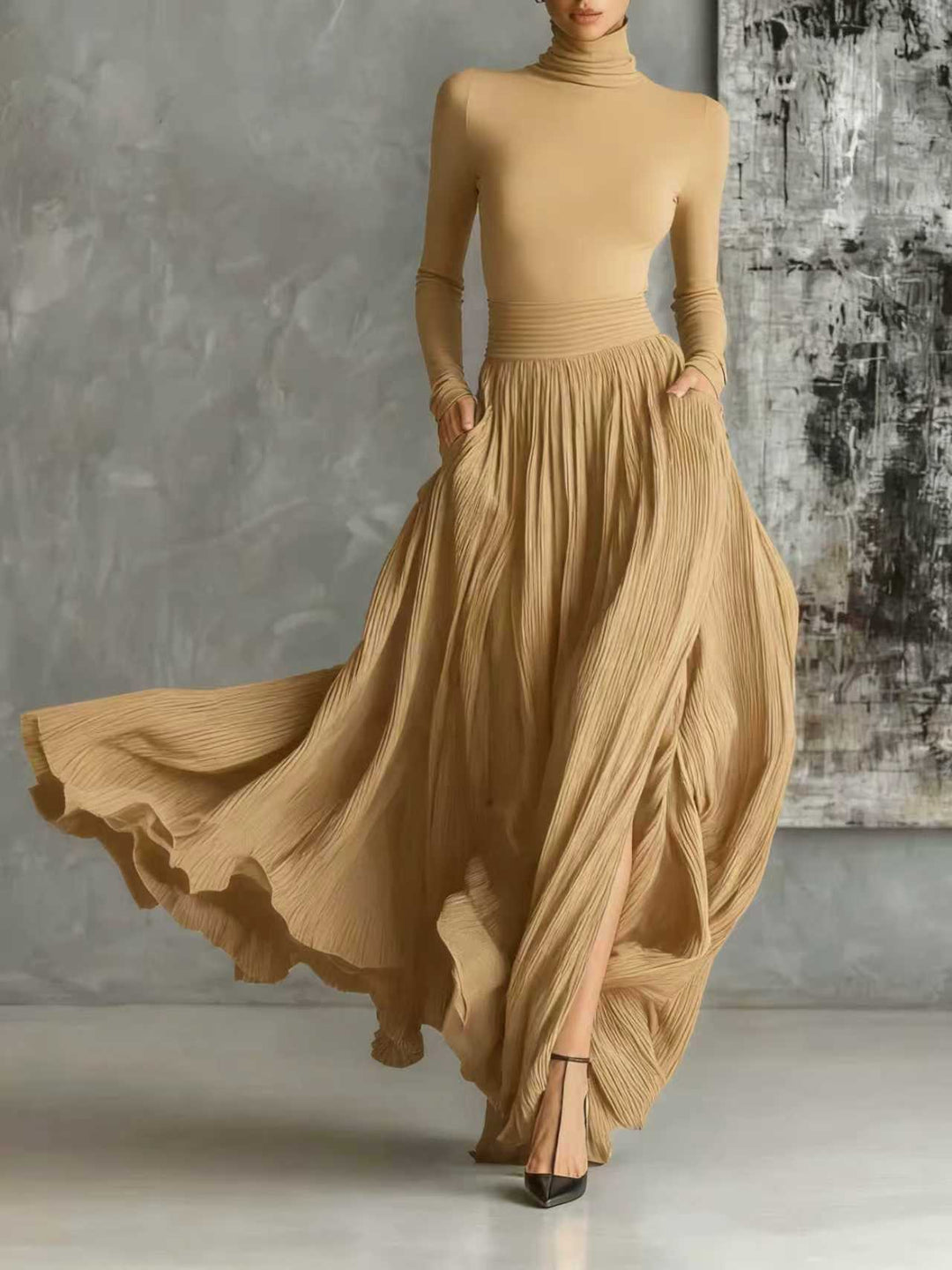 Marion | Black outfit with a turtleneck and a flowing pleated skirt